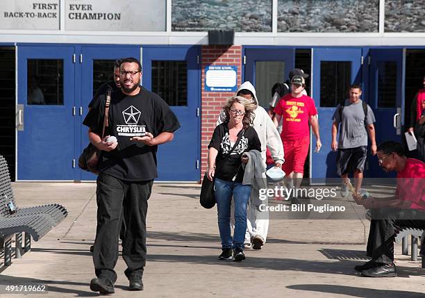 Fiat Chrysler Automobile workers exit from the Warren Truck Assembly Plant at the end of their shift October 7, 2015 in Warren, Michigan. The United...