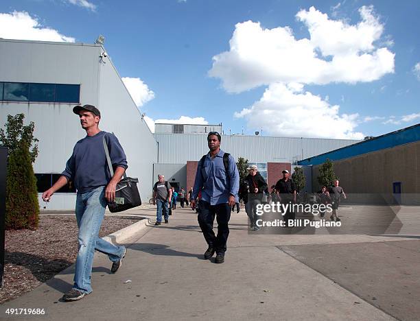 Fiat Chrysler Automobile workers exit from the Warren Truck Assembly Plant at the end of their shift October 7, 2015 in Warren, Michigan. The United...