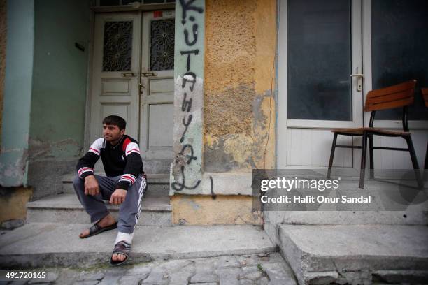 Miner Erdal Bicak who survived the mine accident in Soma, sits looking dejected in Turkey's western province of Manisa May 17, 2014. Manisa...