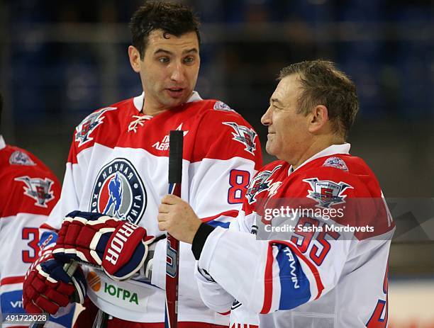 Russian billionaire and businessman Arkady Rotenberg and his nephew, businessman Roman Rotenberg attend an ice hockey match of the Night Hockey...