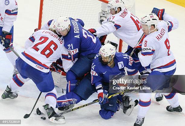 Antoine Roussel and Stephane Da Costa of France battle for the puck with Kristian Forsberg, Alexander Bonsaksen and Mads Hansen of Norway during the...