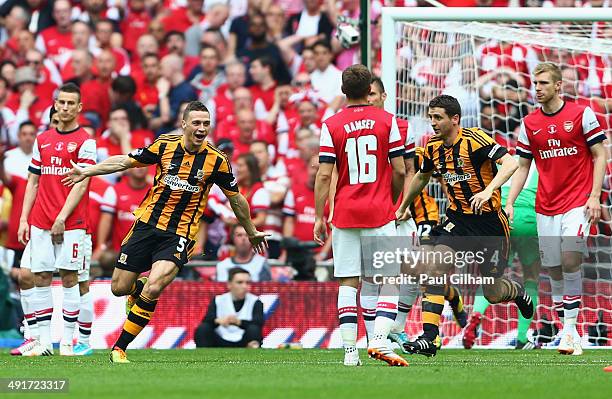 James Chester of Hull City celebrates as he scores their first goal during the FA Cup with Budweiser Final match between Arsenal and Hull City at...