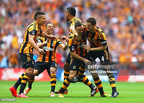 James Chester of Hull City celebrates with team mates as he scores their first goal during the FA Cup with Budweiser Final match between Arsenal and...