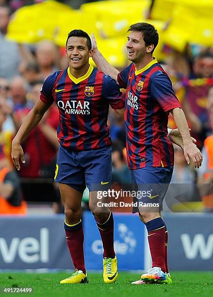 Alexis Sanchez of FC Barcelona celebrates with his teammate Lionel Messi of FC Barcelona after scoring the opening goal during the La Liga match...