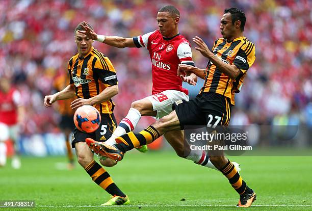 Kieran Gibbs of Arsenal takes on James Chester and Ahmed Elmohamady of Hull City during the FA Cup with Budweiser Final match between Arsenal and...