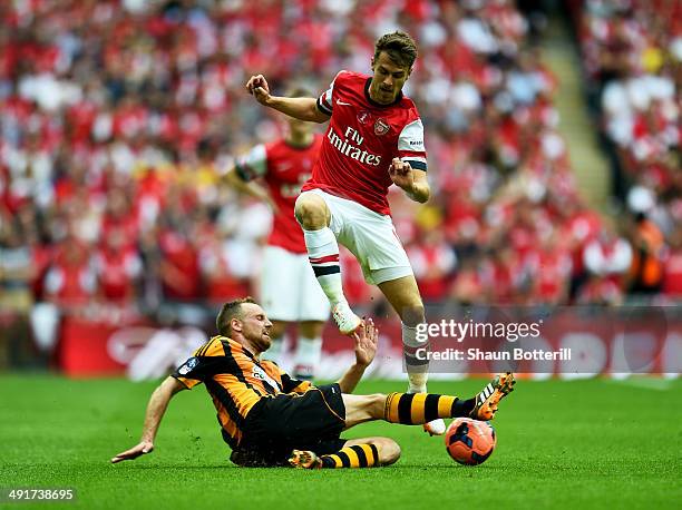 David Meyler of Hull City tackles Aaron Ramsey of Arsenal during the FA Cup with Budweiser Final match between Arsenal and Hull City at Wembley...