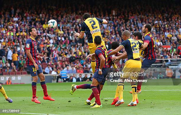 Diego Godin of Club Atletico de Madrid scores his goal during the La Liga match between FC Barcelona and Club Atletico de Madrid at Camp Nou on May...