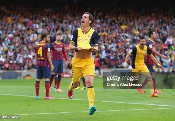 Diego Godin of Club Atletico de Madrid celebrates after scoring his goal during the La Liga match between FC Barcelona and Club Atletico de Madrid at...