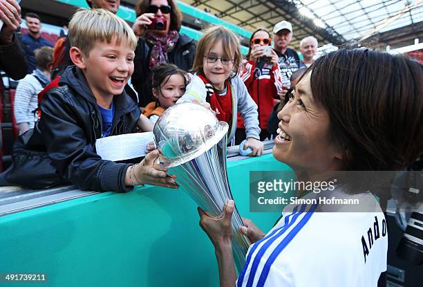 Kozue Ando of Frankfurt celebrates winning with the trophy after the Women's DFB Cup Final between SGS Essen and 1. FFC Frankfurt at...