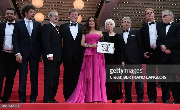 Mexican-US actress and producer Salma Hayek-Pinault holds a cardboard reading "# Bring back our girls", as a sign of support for the kidnapped...