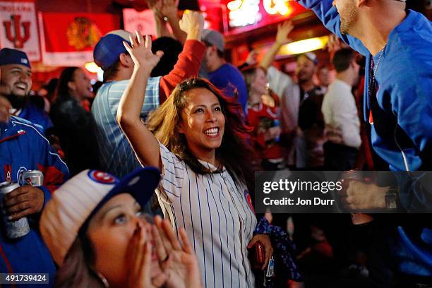 Ana Flores of Chicago celebrates after Kyle Schwarber of the Chicago Cubs hit a two run homerun against the Pittsburgh Pirates during the third...