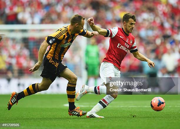 Aaron Ramsey of Arsenal evades David Meyler of Hull City during the FA Cup with Budweiser Final match between Arsenal and Hull City at Wembley...