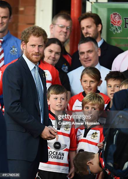 Prince Harry meets staff and players during a visit to Paignton Rugby Club on October 7, 2015 in Paignton, England. Prince Harry is visiting the club...