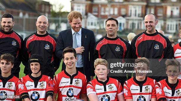 Prince Harry meets staff and players during a visit to Paignton Rugby Club on October 7, 2015 in Paignton, England. Prince Harry is visiting the club...