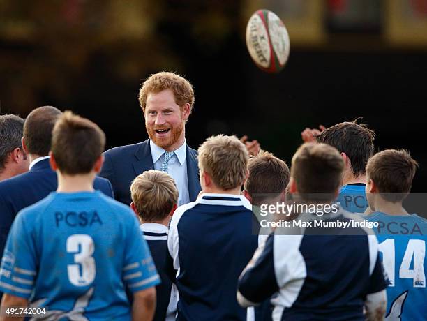 Prince Harry meets young players as he visits Paignton Rugby Club to present them with an RFU, Gold Standard Facilities Award on October 7, 2015 in...