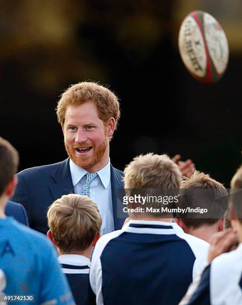 Prince Harry meets young players as he visits Paignton Rugby Club to present them with an RFU, Gold Standard Facilities Award on October 7, 2015 in...