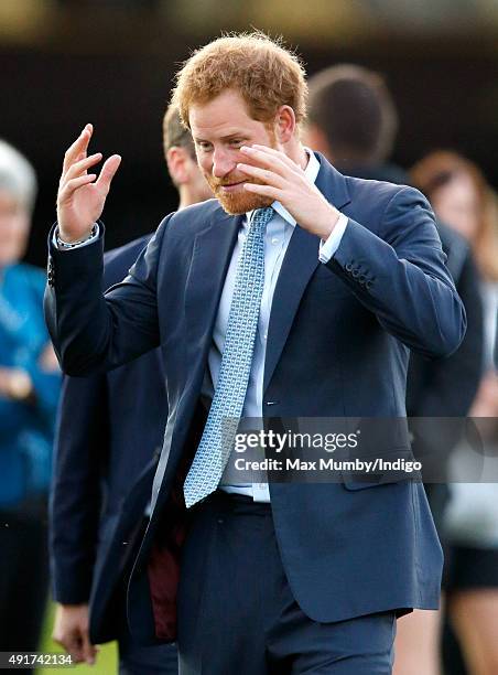 Prince Harry visits Paignton Rugby Club to present them with an RFU, Gold Standard Facilities Award on October 7, 2015 in Paignton, England.