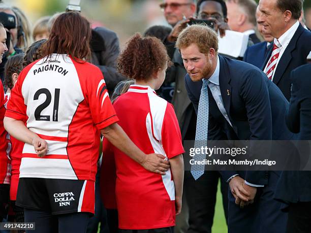 Prince Harry meets young players as he visits Paignton Rugby Club to present them with an RFU, Gold Standard Facilities Award on October 7, 2015 in...