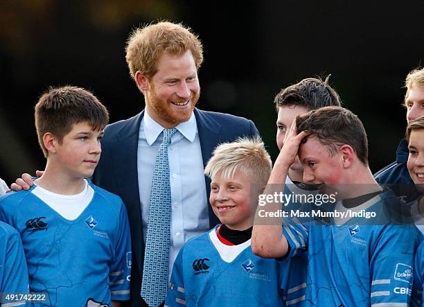 Prince Harry meets young players as he visits Paignton Rugby Club to present them with an RFU, Gold Standard Facilities Award on October 7, 2015 in...