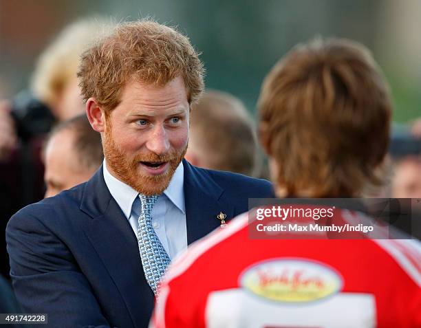 Prince Harry meets young players as he visits Paignton Rugby Club to present them with an RFU, Gold Standard Facilities Award on October 7, 2015 in...