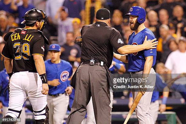 The Chicago Cubs and Pittsburgh Pirates benches clear after Jake Arrieta of the Chicago Cubs is hit by a pitch thrown by Tony Watson of the...