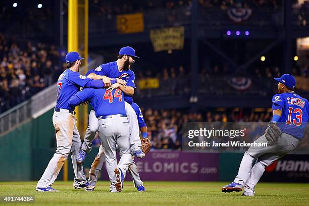 Jake Arrieta of the Chicago Cubs celebrates with Anthony Rizzo of the Chicago Cubs, Kris Bryant of the Chicago Cubs and Starlin Castro of the Chicago...