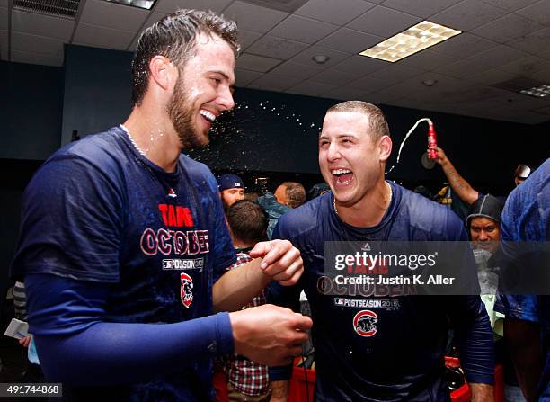 Anthony Rizzo of the Chicago Cubs and Kris Bryant celebrate in the locker room after defeating the Pittsburgh Pirates in the National League Wild...