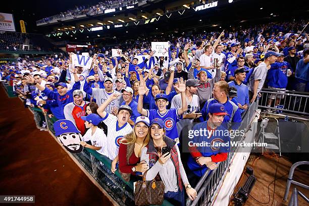 Chicago Cubs fans celebrate after the Chicago Cubs defeat the Pittsburgh Pirates to win the National League Wild Card game at PNC Park on October 7,...