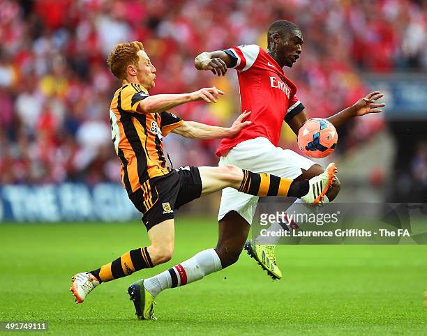 Stephen Quinn of Hull City challenges Yaya Sanogo of Arsenal during the FA Cup with Budweiser Final match between Arsenal and Hull City at Wembley...