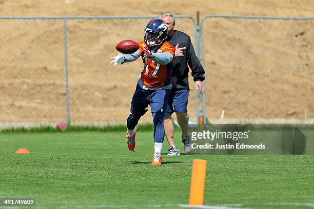 Linebacker Corey Nelson of the Denver Broncos participates in drills with linebackers coach Richard Smith during rookie minicamp at Dove Valley on...