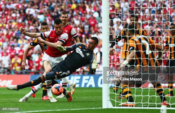 Laurent Koscielny of Arsenal shoots past goalkeeper Allan McGregor of Hull City as he scores their second goal during the FA Cup with Budweiser Final...