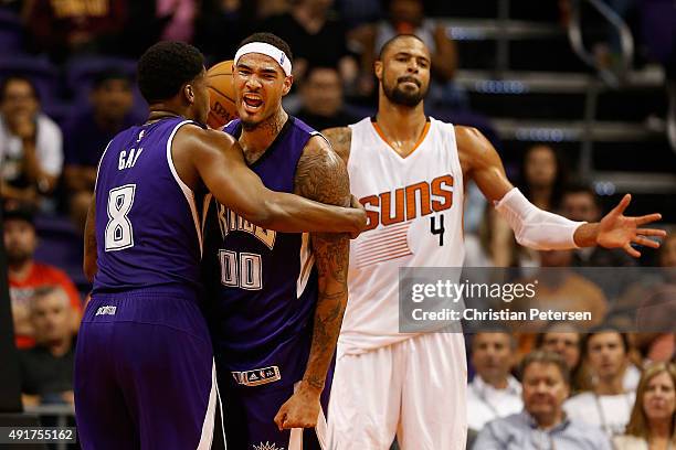 Willie Cauley-Stein of the Sacramento Kings celebrates with Rudy Gay after scoring against Tyson Chandler of the Phoenix Suns during the second half...