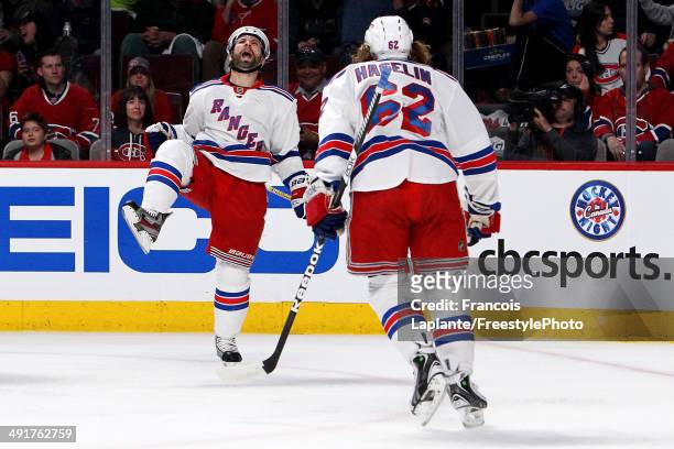 Martin St. Louis of the New York Rangers celebrates with Carl Hagelin after scoring a first period goal against the Montreal Canadiens in Game One of...