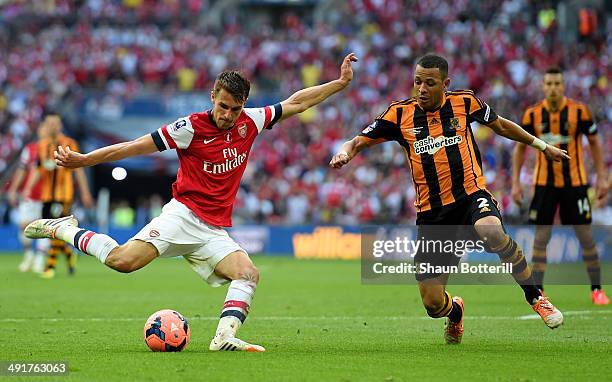 Aaron Ramsey of Arsenal is blocked Liam Rosenior of Hull City during the FA Cup with Budweiser Final match between Arsenal and Hull City at Wembley...