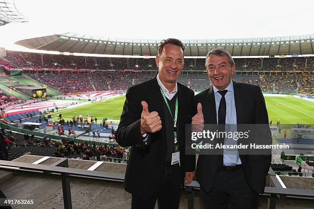 Wolfgang Niersbach, President of German Football Association jokes with Tom Hanks prior to the DFB Cup Final match between Borussia Dortmund and FC...