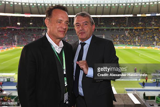 Wolfgang Niersbach, President of German Football Association talks to Tom Hanks prior to the DFB Cup Final match between Borussia Dortmund and FC...