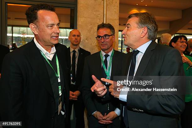 Wolfgang Niersbach , President of German Football Association and Helmut Sandrock general secretary of German Football Association talk to Tom Hanks...