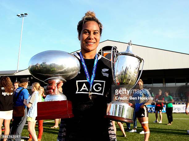 Huriana Manuel of New Zealand poses with the two trophies during the IRB Women's Sevens World Series on May 17, 2014 in Amsterdam, Netherlands.
