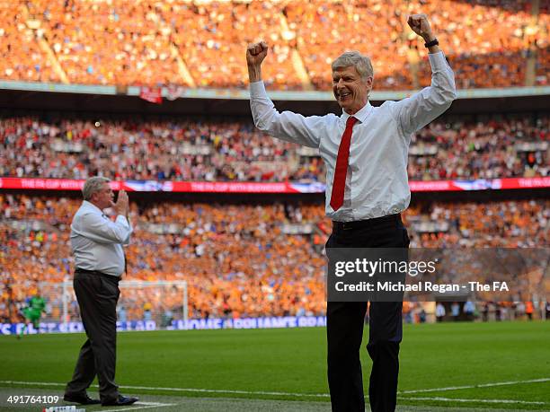 Arsene Wenger, manager of Arsenal celebrates next to Steve Bruce, manager of Hull City during the FA Cup with Budweiser Final match between Arsenal...