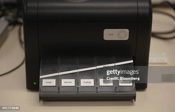 Quality control sorting machine for real and synthetic diamonds sits on a workbench at De Beers Technologies research laboratory in Maidenhead, U.K.,...