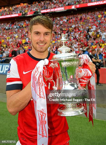 Aaron Ramsey of Arsenal poses with the FA Cup after the FA Cup with Budweiser Final match between Arsenal and Hull City at Wembley Stadium on May 17,...