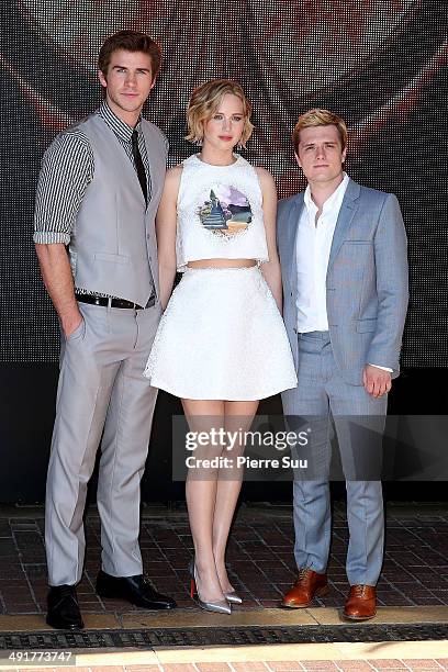 Actors Liam Hemsworth, Jennifer Lawrence and Josh Hutcherson attend the "The Hunger Games: Mockingjay Part 1" Photocall at the 67th Annual Cannes...