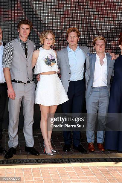 Actors Liam Hemsworth, Jennifer Lawrence, Sam Claflin, Josh Hutcherson attend the "The Hunger Games: Mockingjay Part 1" Photocall at the 67th Annual...