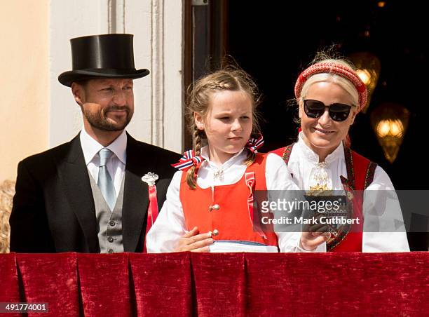 Crown Princess Mette-Marit of Norway and Crown Prince Haakon of Norway with Princess Ingrid Alexandra watch the National Day Childrens Parade from...