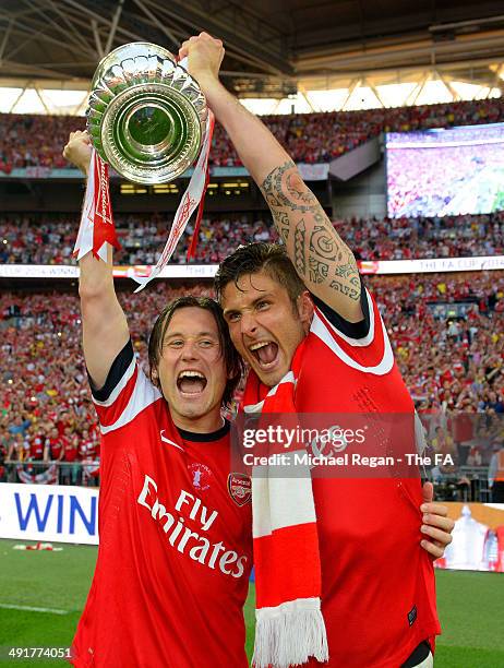 Tomas Rosicky and Olivier Giroud of Arsenal celebrate with the FA Cup after the FA Cup with Budweiser Final match between Arsenal and Hull City at...