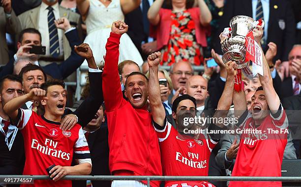 Thomas Vermaelen of Arsenal celebrates with his team-mates as he lifts the FA Cup after the FA Cup with Budweiser Final match between Arsenal and...