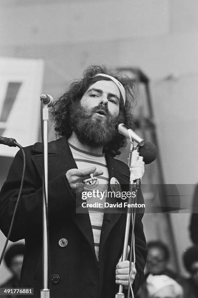 American social and political activist Jerry Rubin speaks at an unspecified protest, circa 1970s. He wears a button that reads 'Hoffa for President.'