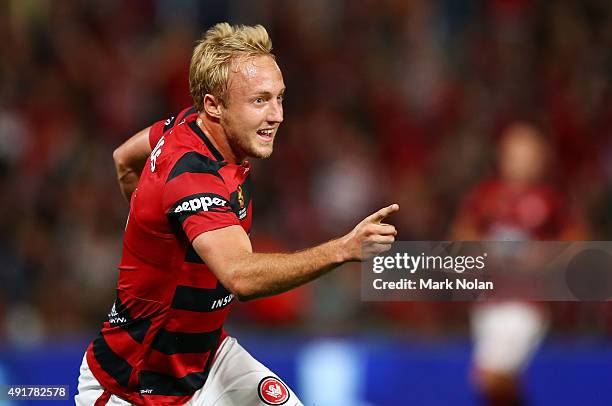 Mitch Nichols of the Wanderers celebrates scoring a goal during the round one A-League match between the Western Sydney Wanderers and the Brisbane...