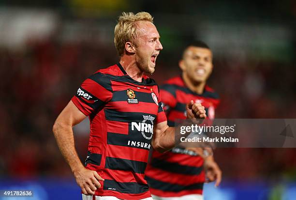 Mitch Nichols of the Wanderers celebrates scoring a goal during the round one A-League match between the Western Sydney Wanderers and the Brisbane...