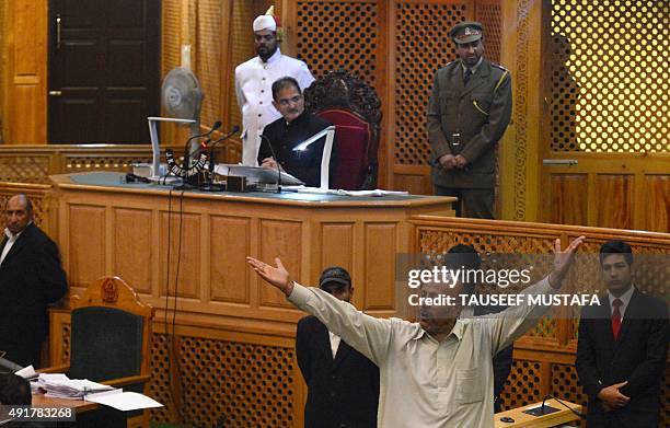 Independent lawmaker, Engineer Rashid shouts after being thrashed by Bhartiya Janta Party legislators in the legislative assembly in Srinagar on...